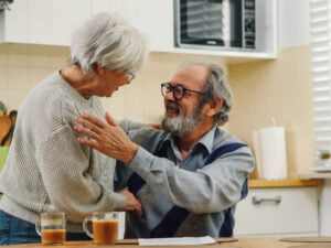 Couple laughing over coffee