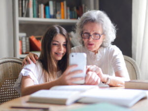Granddaughter teach grandma smartphone