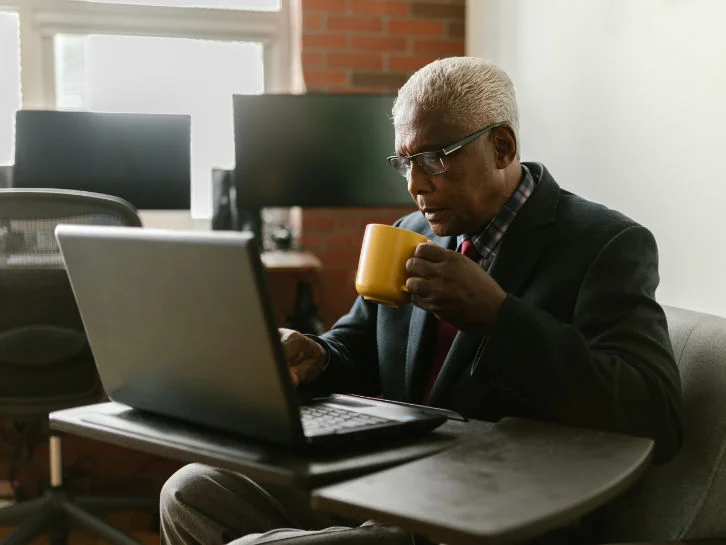 Man Drinking Coffee Laptop