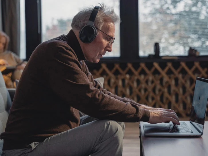 Senior Man Laptop Headphones